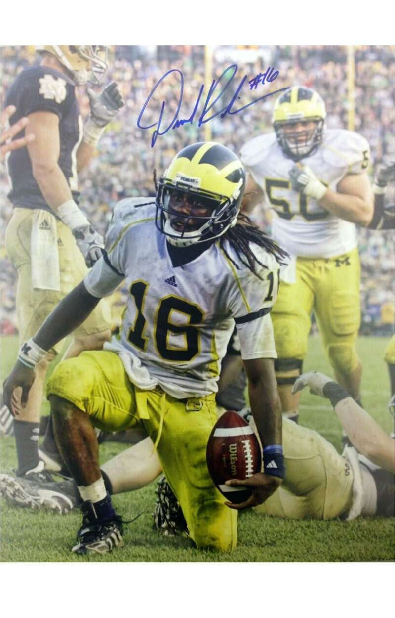 SOLD 979 Denard Robinson Autographed Kneeling vs. Notre Dame 16x20