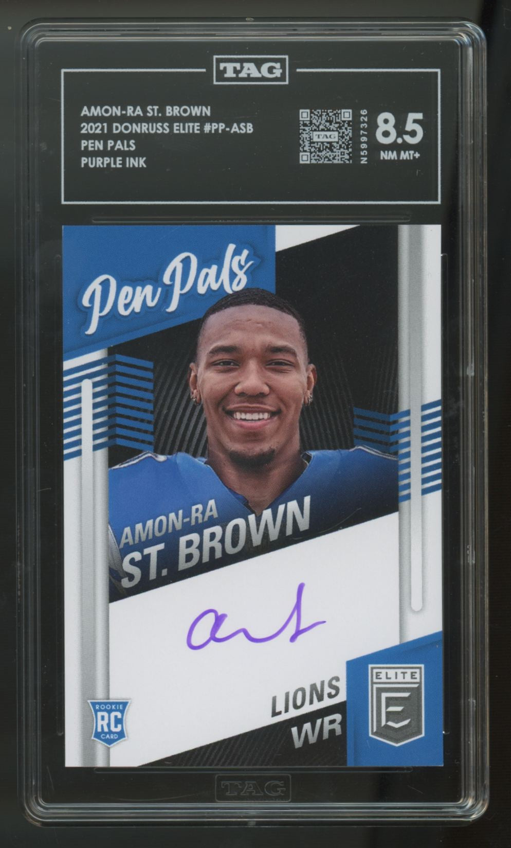 2021 Donruss Elite Amon-Ra St. Brown RC Pen Pals Purple Ink Auto #PP-ASB TAG 8.5