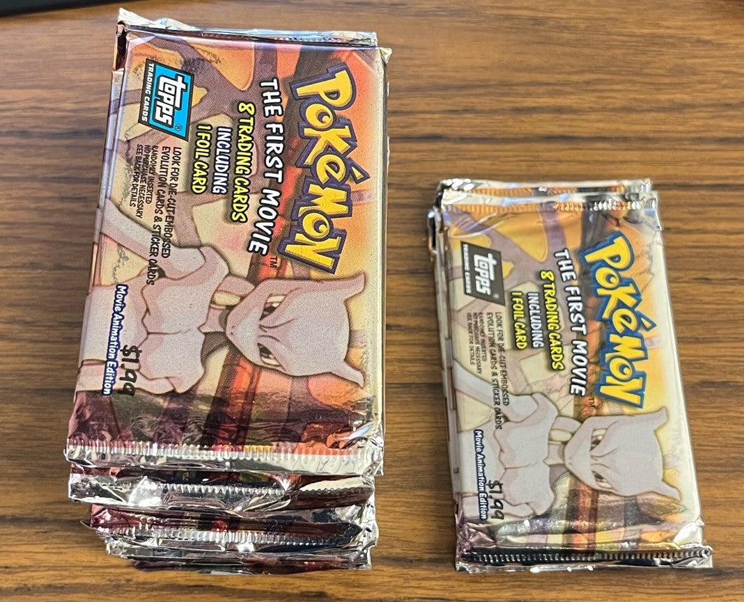 1999 Topps Pokemon The First Movie Lot of 30 Sealed Packs (26 Blue 4 Black)