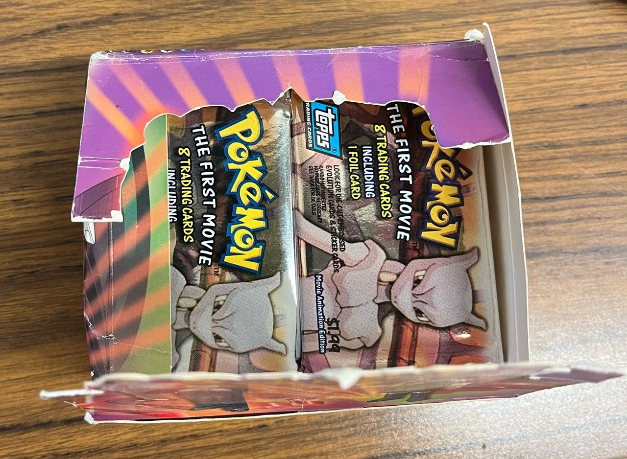 1999 Topps Pokemon The First Movie Lot of 30 Sealed Packs (26 Blue 4 Black)